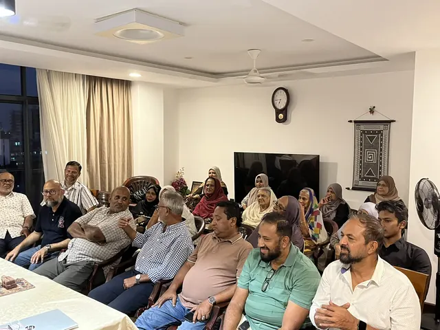 Family members gathered for a Dar Us Salam meeting.